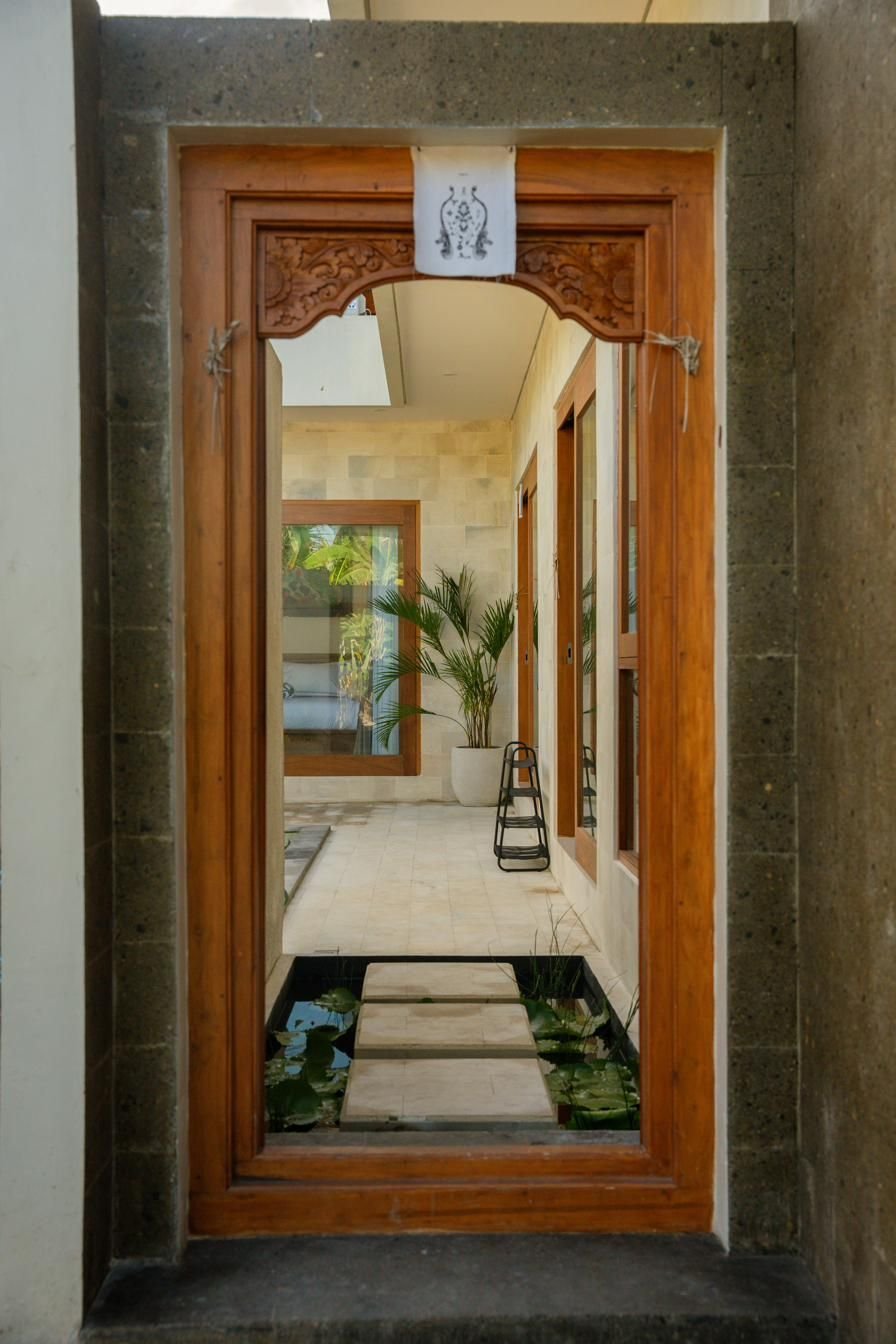 Entrance walkway over a lotus pond